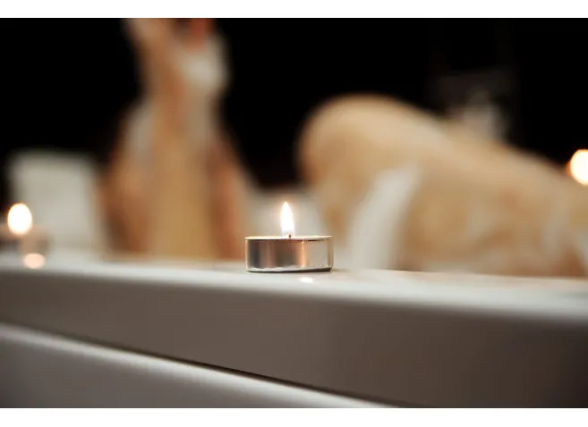 Woman taking bath. Legs