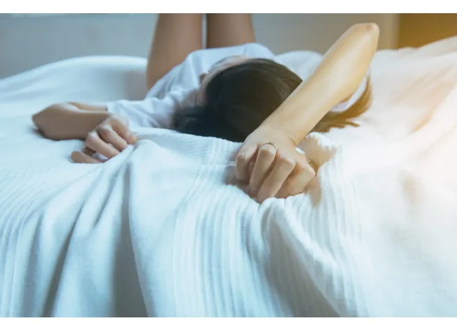 Close up of hand woman sign orgasm,Finger female pulling white bedsheet,Concept of sexual relations