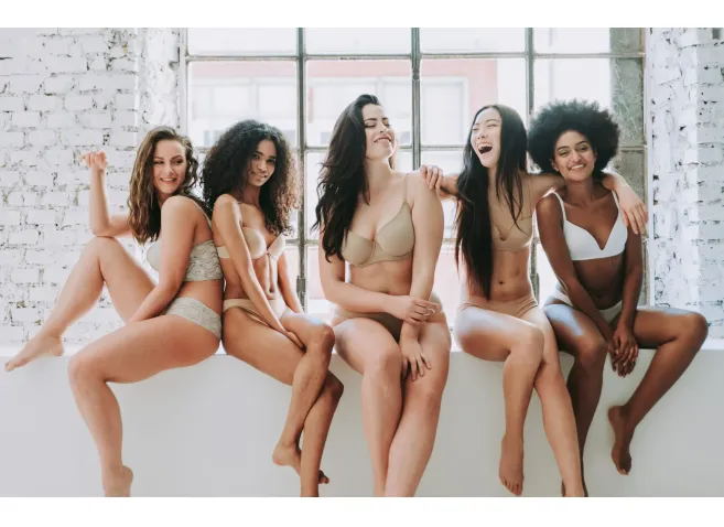 Group of women with different body and ethnicity posing together to show the woman power and strength. Curvy and skinny kind of female body concept